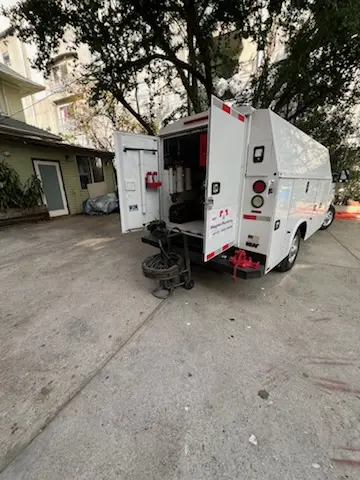 Magnet Plumbing service vehicle on-site for Grease Trap Cleaning in Big Park